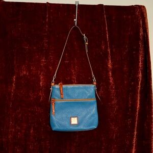 Dooney and Bourke Dillen Pebbled Leather Letter Carrier.